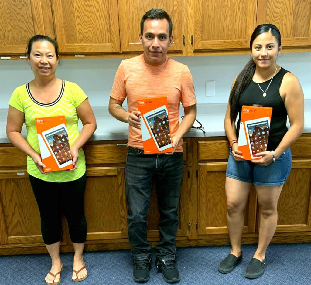 Linh, Roberto, and Yesenia with their tablets
